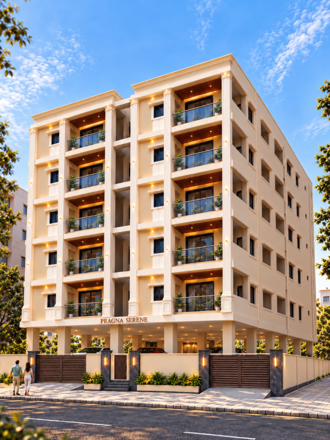 Right-front view of the building showing the balconies, the stilt level and the boundary wall with two vehicle gates
